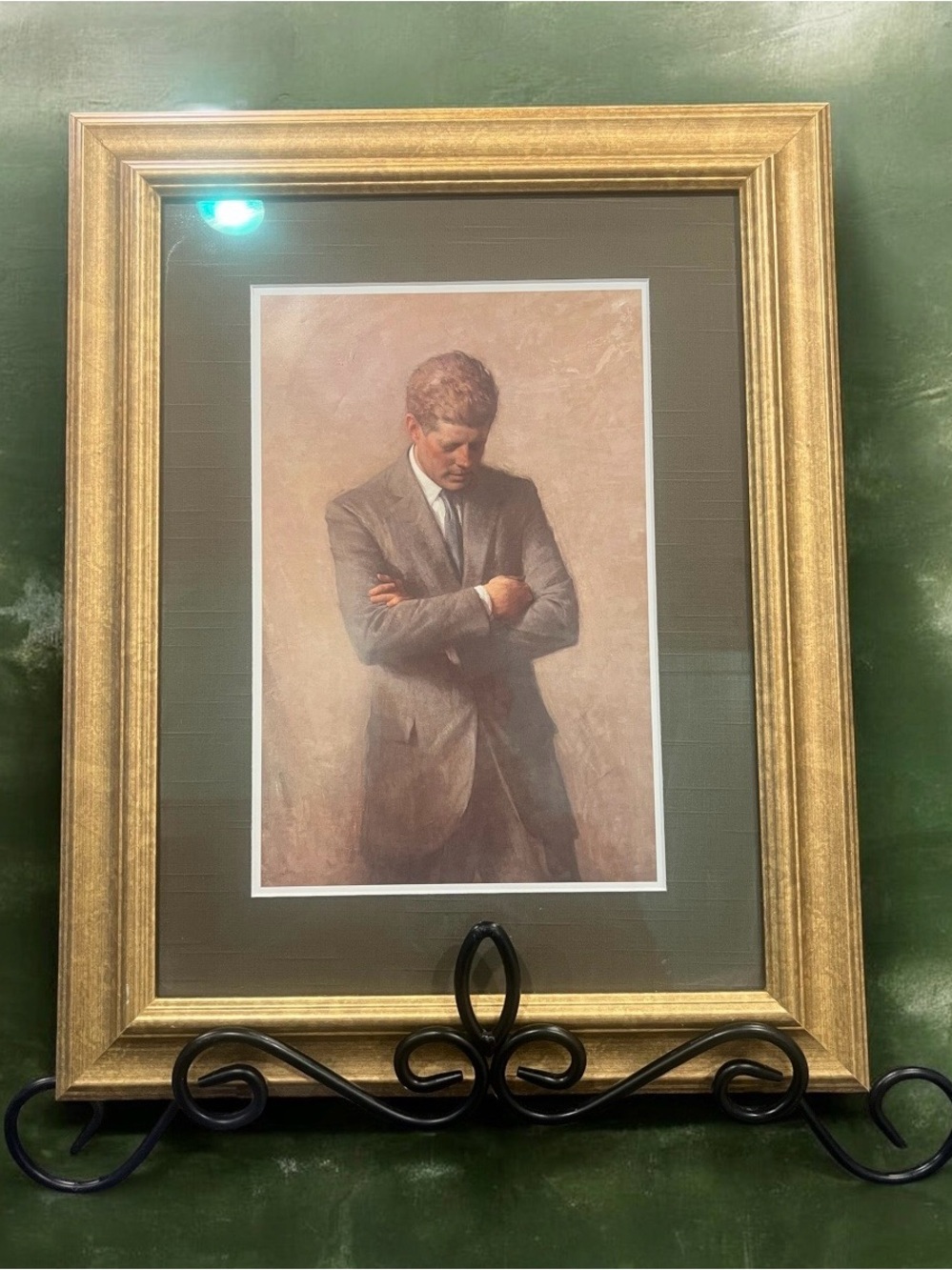 Framed print of President John F.
Kennedy by Aaron Shikler.